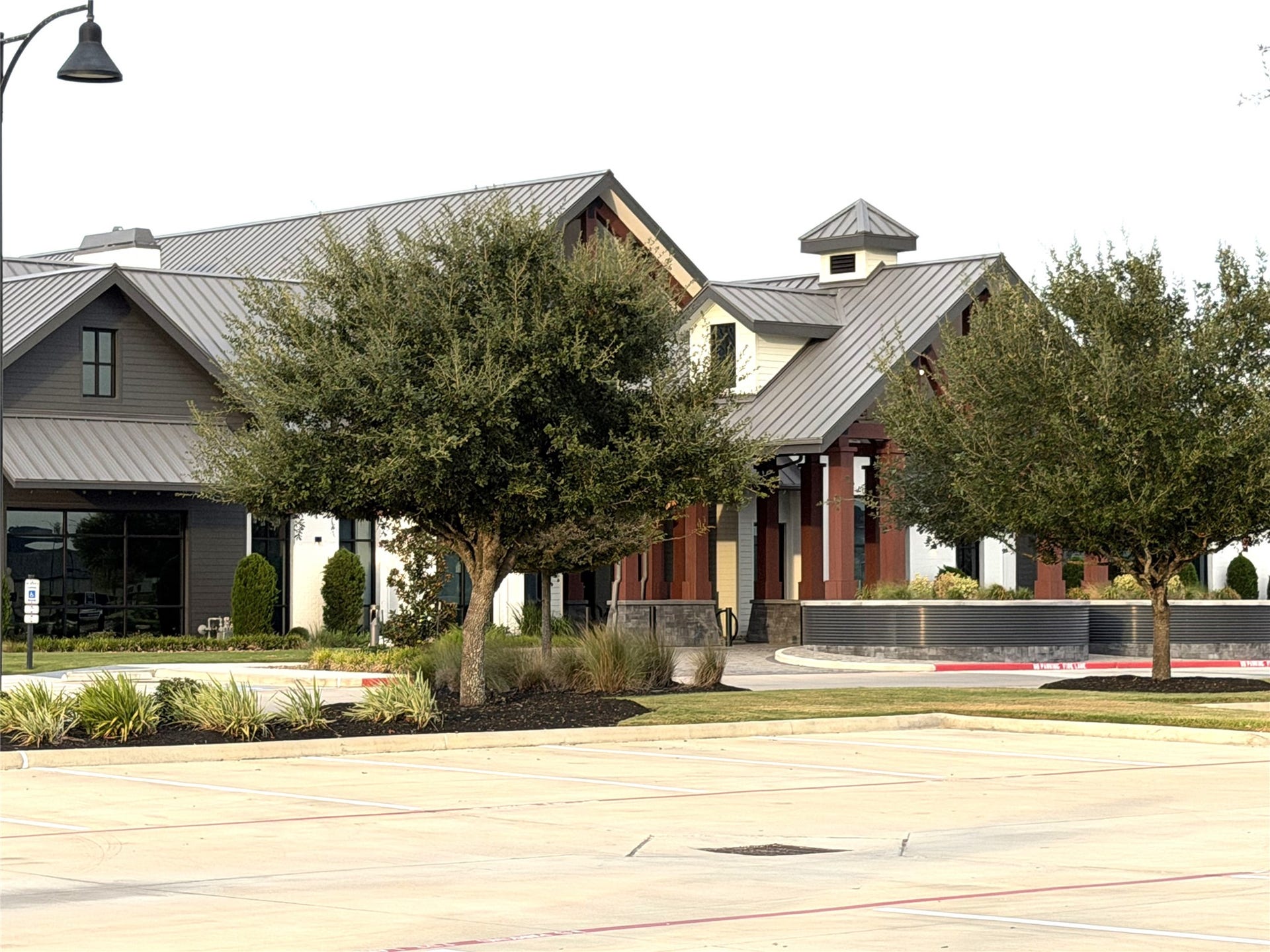 8015 Prospect Drive, Fulshear, TX 77441 Beautifully landscaped grounds and striking architectural details enhance the appeal of Del Webb Fulshear's clubhouse. Enjoy convenient access to exceptional amenities and an active community lifestyle.
