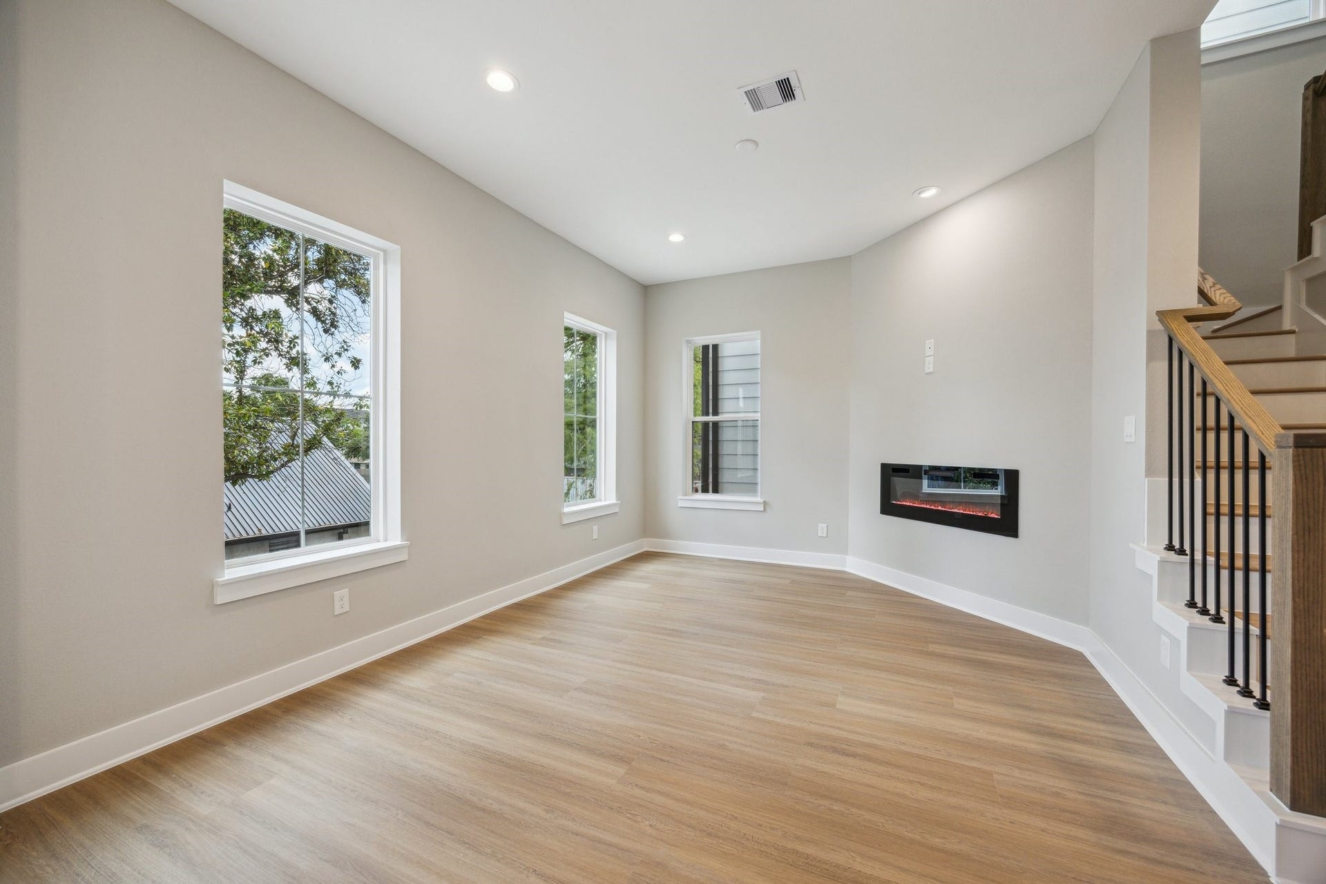 812 Thornton Street, #F, Houston, TX 77018 Living Room with electric fireplace, a rare feature *picture is of a previously constructed home by the builder. 812 Thornton finishes will be very similar but this photo is meant to show craftsmanship, quality and to show a product very similar to the plan for 812 Thornton. However, the builder has the right to change finishes at their sole discretion.