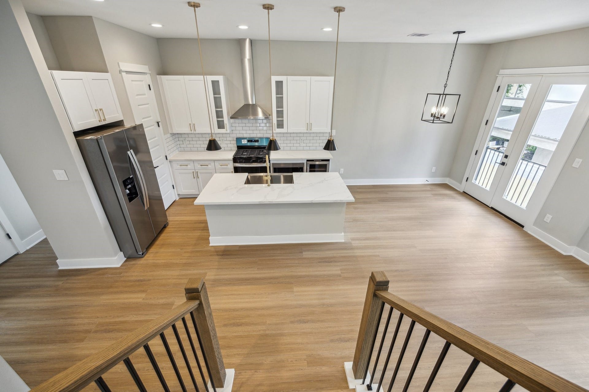 812 Thornton Street, #F, Houston, TX 77018 View from stairs towards kitchen *picture is of a previously constructed home by the builder. 812 Thornton finishes will be very similar but this photo is meant to show craftsmanship, quality and to show a product very similar to the plan for 812 Thornton. However, the builder has the right to change finishes at their sole discretion.