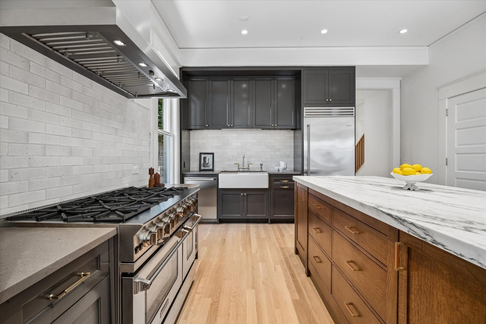 1203 Heights Boulevard, Houston, TX 77008 All cabinets are custom painted in a rich deep color. The hardwood floors are light and bright. The kitchen is fill with natural light and this fabulous 6 burner Blue Star double oven.