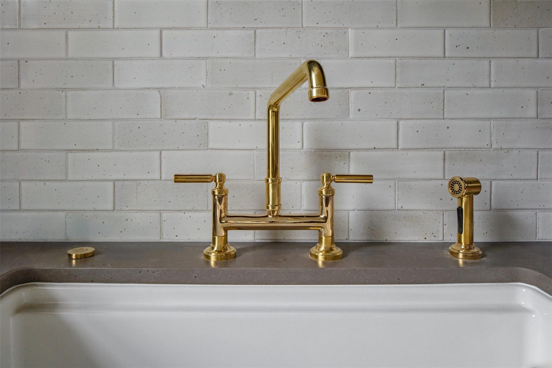 1203 Heights Boulevard, Houston, TX 77008 The hardware is made of polished brass accented with a granite counter top, subway tile and a beautiful porcelain farm sink.