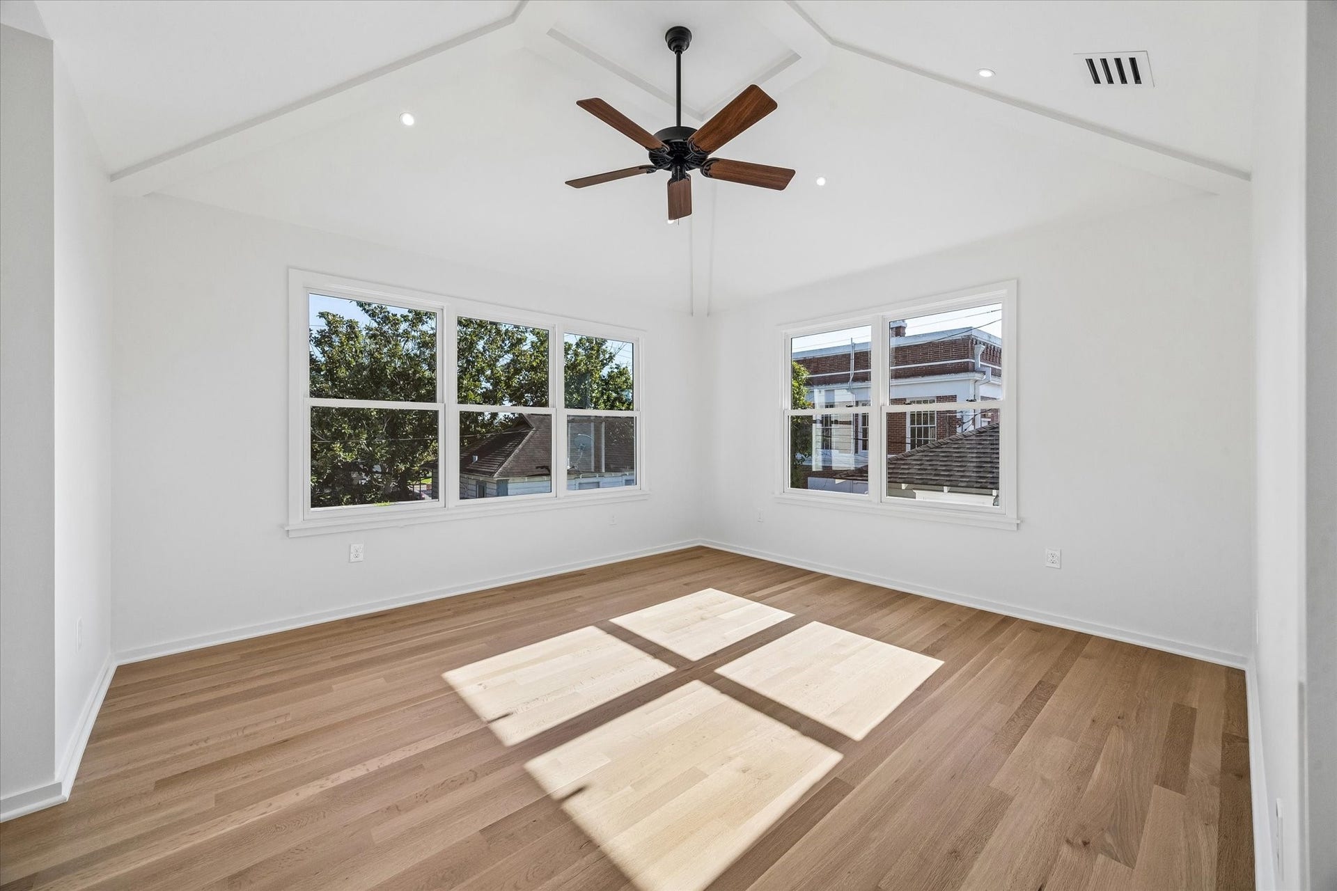 1203 Heights Boulevard, Houston, TX 77008 The primary suite is on the second floor. It is rich with natural light, vaulted ceilings and a timeless ceiling fan.