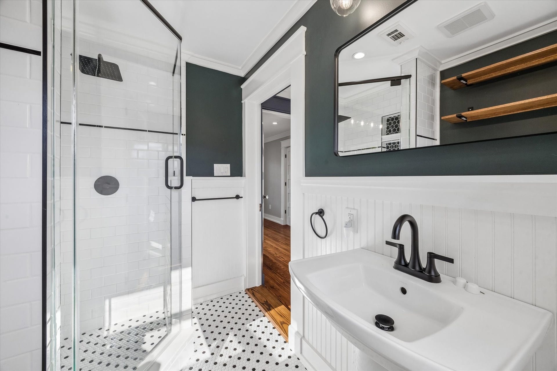 1203 Heights Boulevard, Houston, TX 77008 Updated bathroom in the garage apartment has a walk in glass shower.