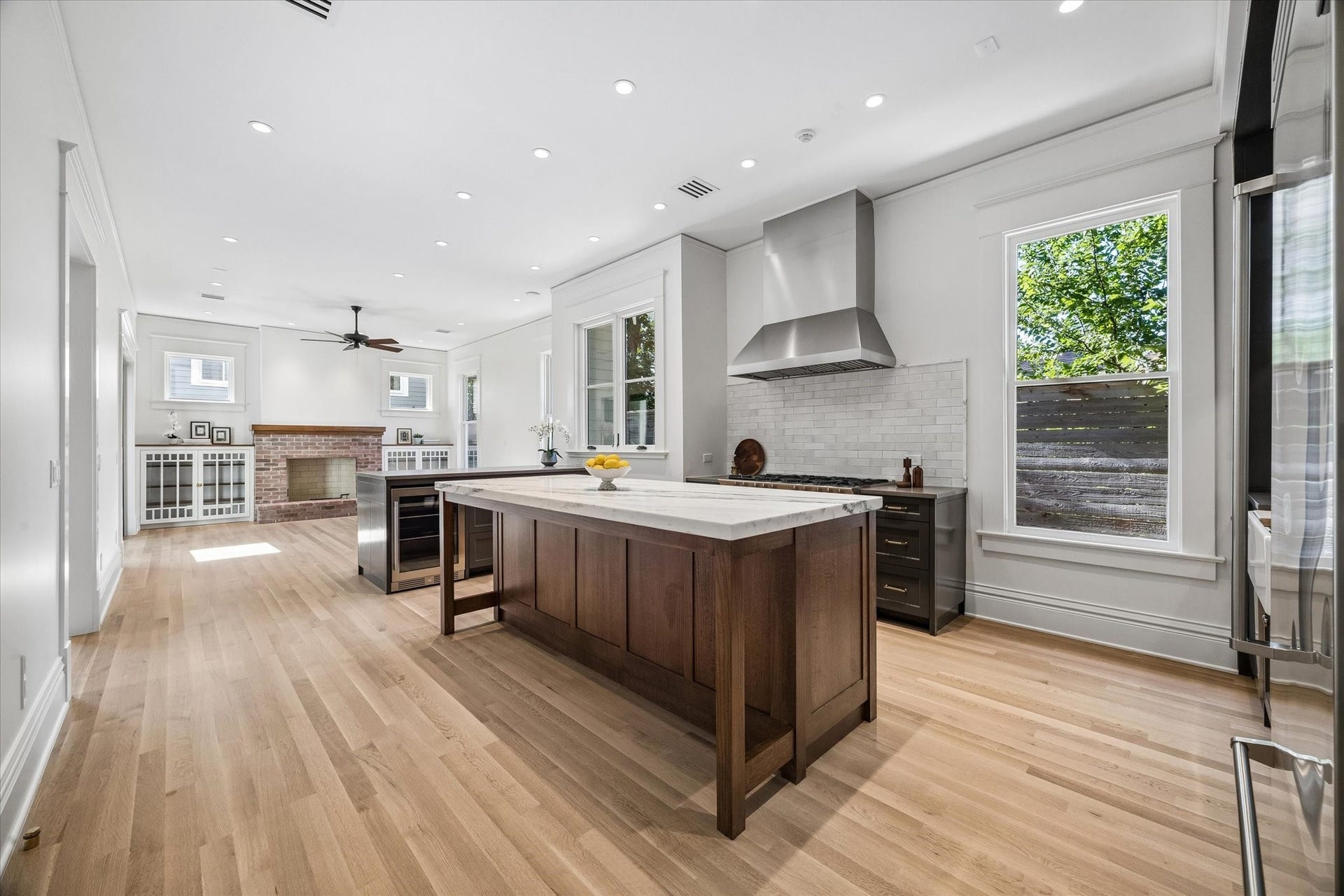 1203 Heights Boulevard, Houston, TX 77008 A tree was salvaged from this property and milled to custom build this island, the primary bath vanity, mantels and bookcase tops. The counter top is made out of a 2" confectionary marble slab.