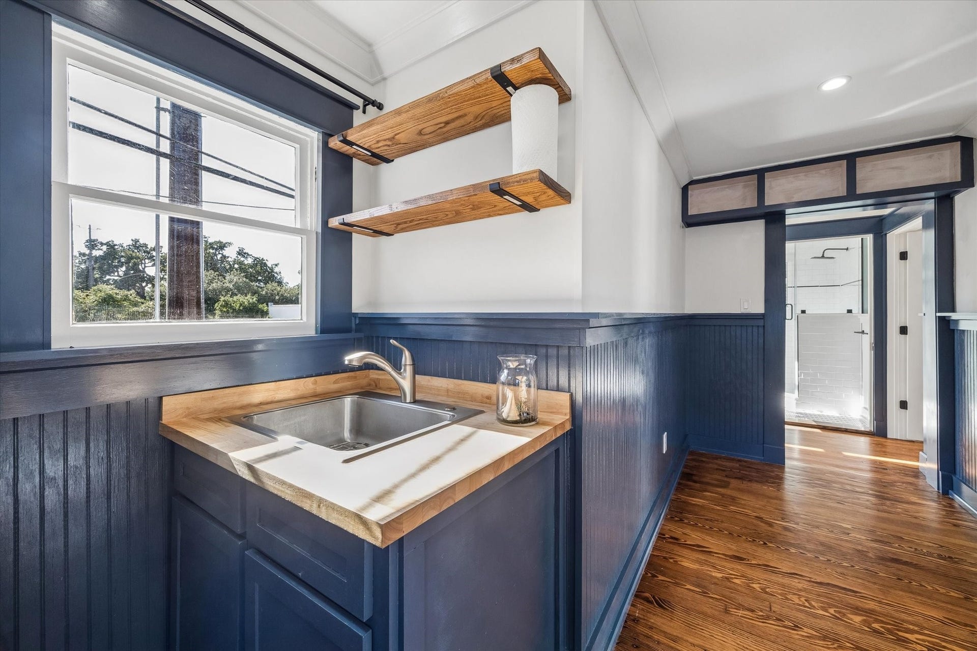 1203 Heights Boulevard, Houston, TX 77008 The kitchenette has a small table and sink.