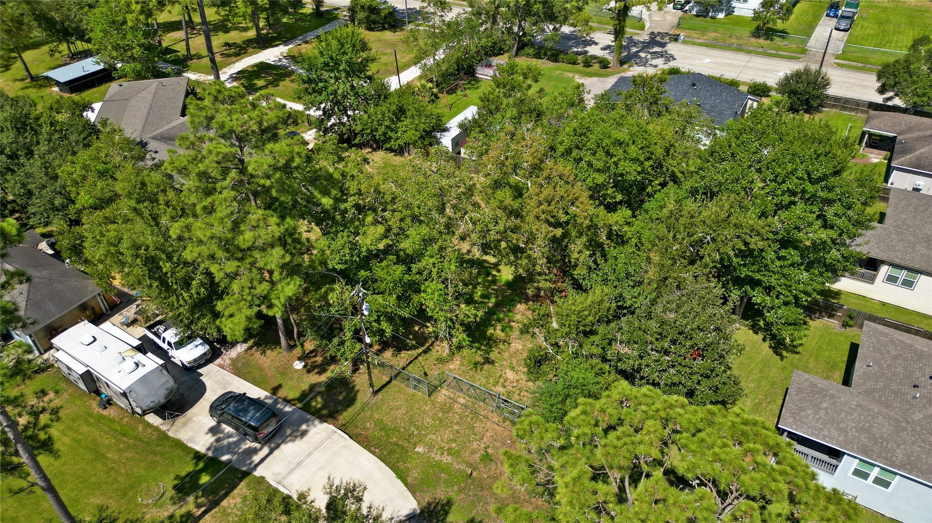 00 Ash, Dickinson, TX 77539 Established Trees and utility access at the street
