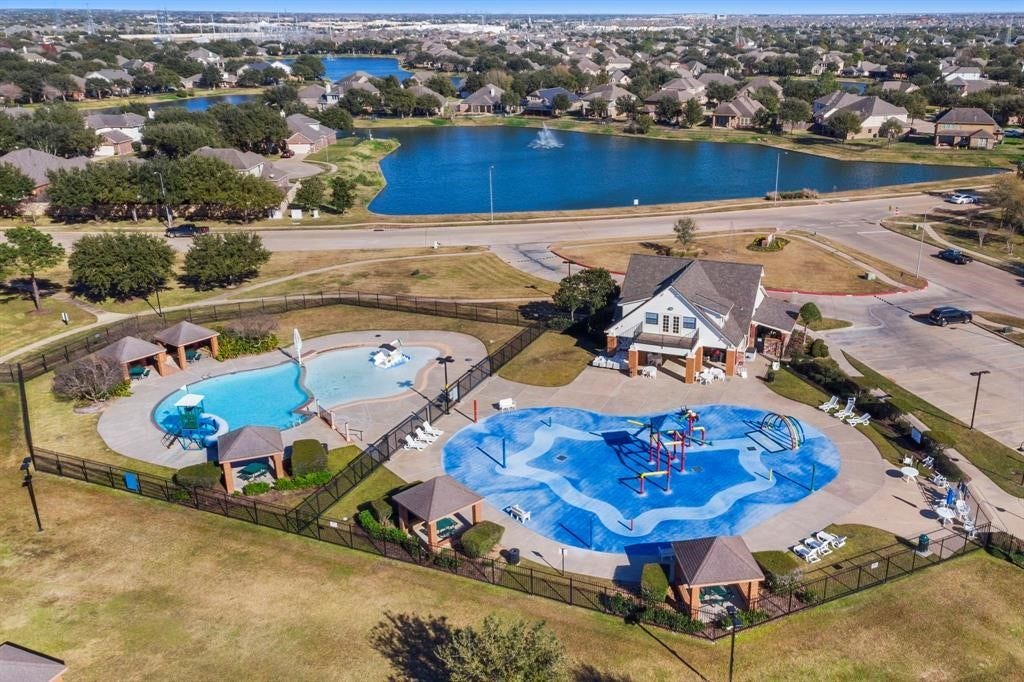 26130 Ripley Hills Drive, Richmond, TX 77406 Discover a vibrant community oasis featuring a refreshing pool and exciting splashpad, perfect for family fun and relaxation amidst scenic surroundings.