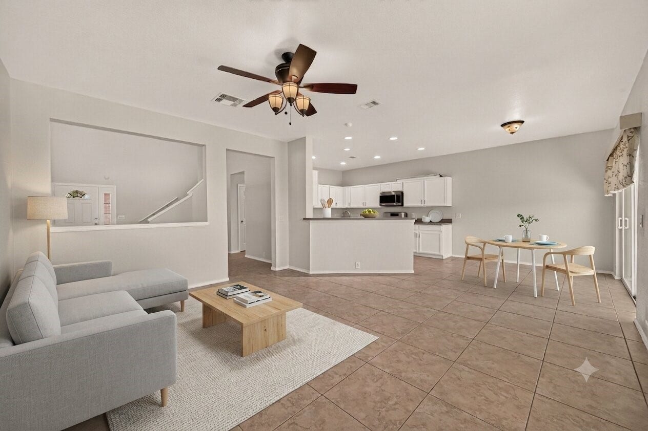 26130 Ripley Hills Drive, Richmond, TX 77406 This virtually staged family room offers a spacious, light-filled haven with modern furnishings, seamlessly connecting the living and kitchen areas for effortless entertaining and everyday comfort.