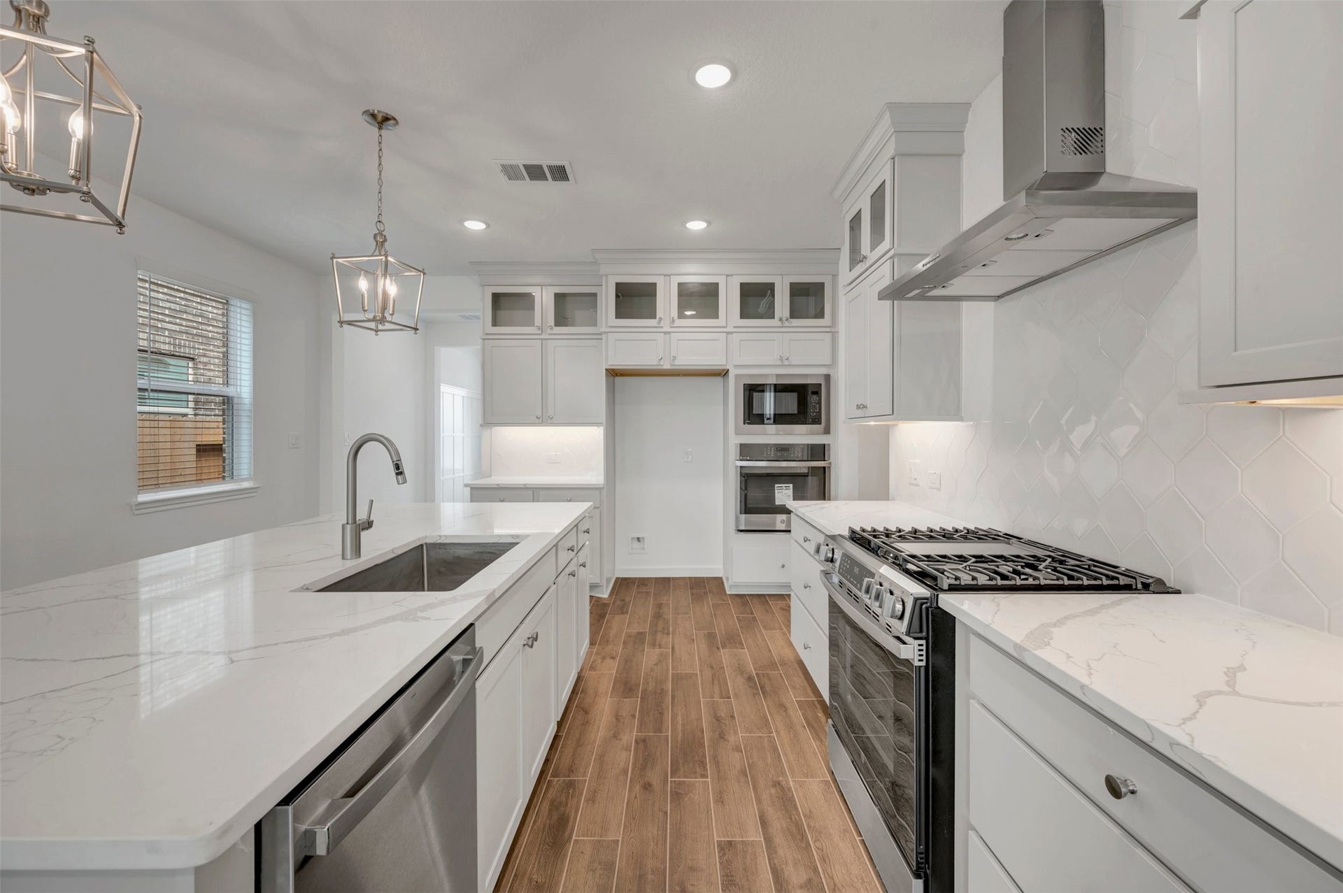23635 Gulf Prairie Drive, Katy, TX 77493 Stylish kitchen with stacked cabinets and stainless appliances