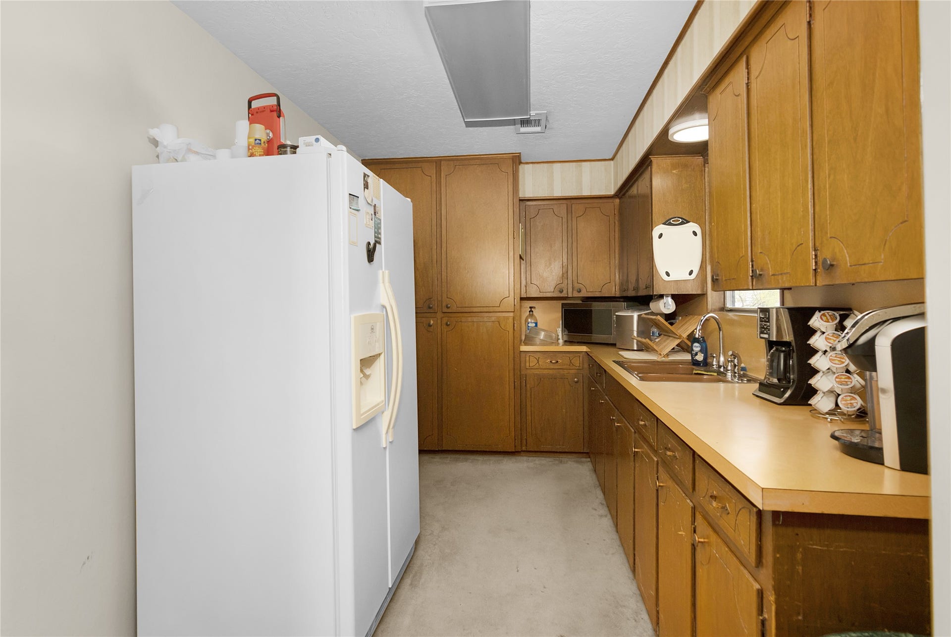 856 Bonita Street, Bayou Vista, TX 77563 Kitchen in upstairs with refrigerator and pantry.