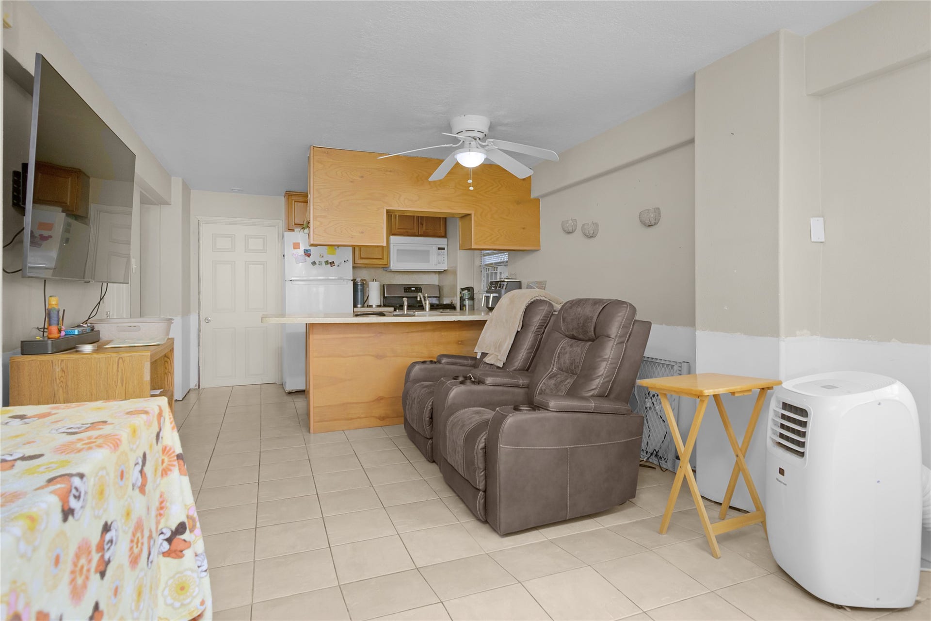 856 Bonita Street, Bayou Vista, TX 77563 Open living room/kitchen in quarters on the right side.