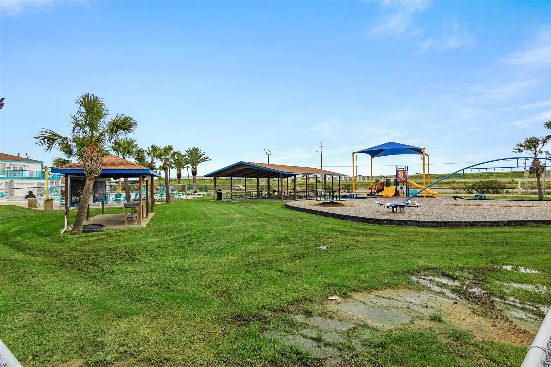 856 Bonita Street, Bayou Vista, TX 77563 Bayou Vista playground, covered picnic area, community center and gorgeous pool with beautiful palm trees,