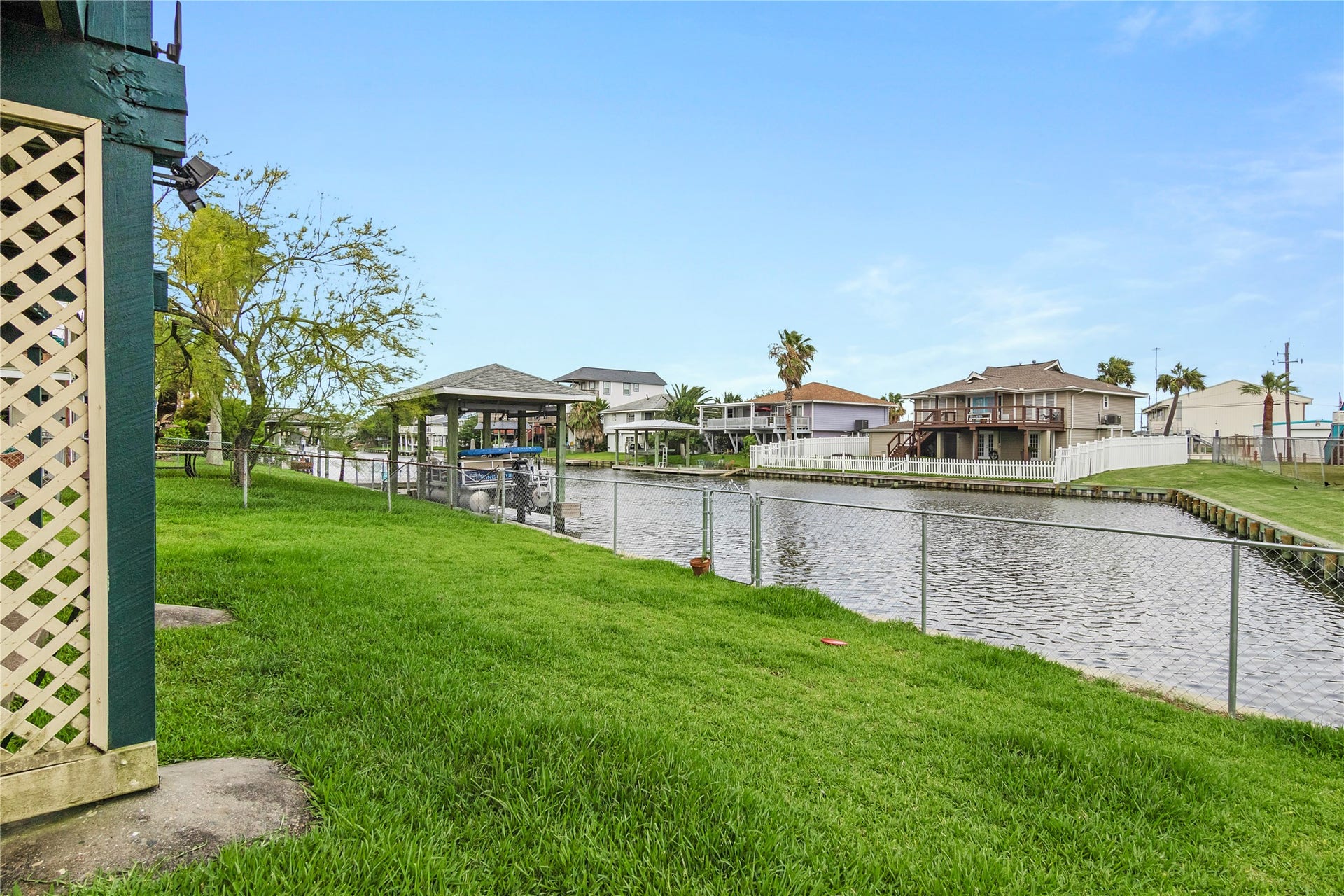 856 Bonita Street, Bayou Vista, TX 77563 Beautiful green grass and fence.