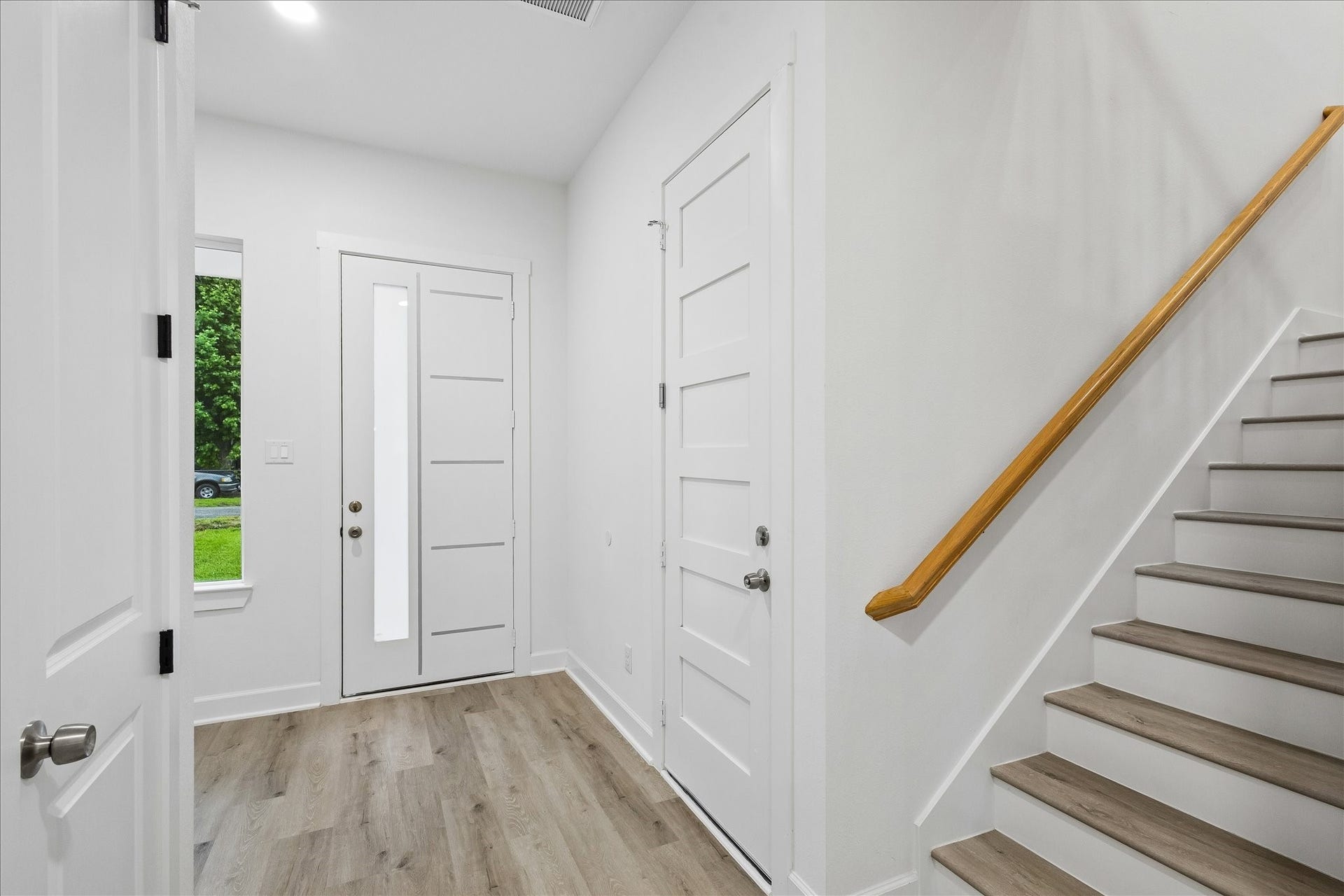 8715 Shotwell Street, #B, Houston, TX 77016 A view of the inviting entryway and staircase leading to the second floor.