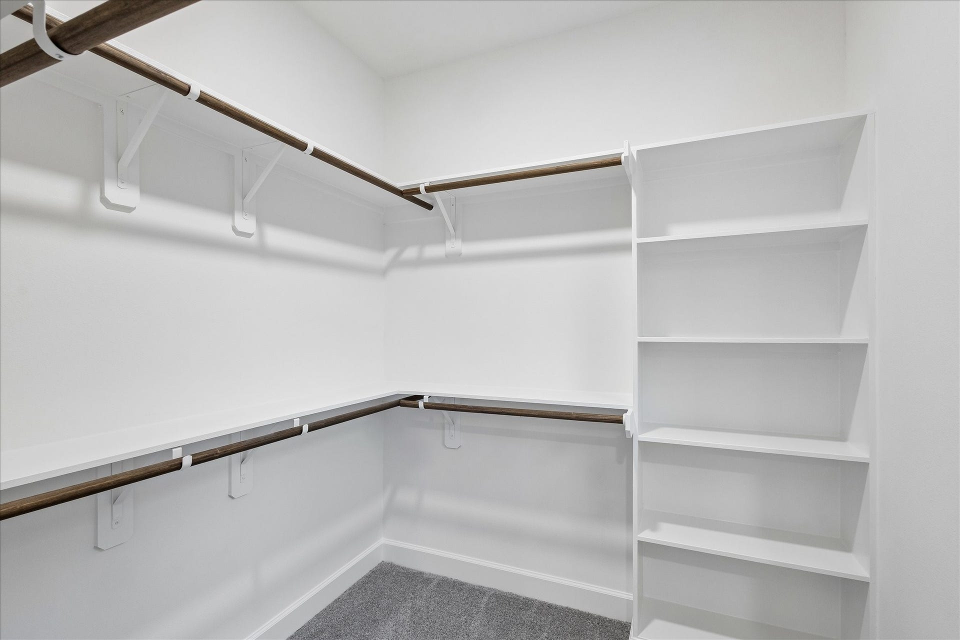 8715 Shotwell Street, #B, Houston, TX 77016 A view of the primary suite's expansive walk-in closet, offering ample wardrobe storage.