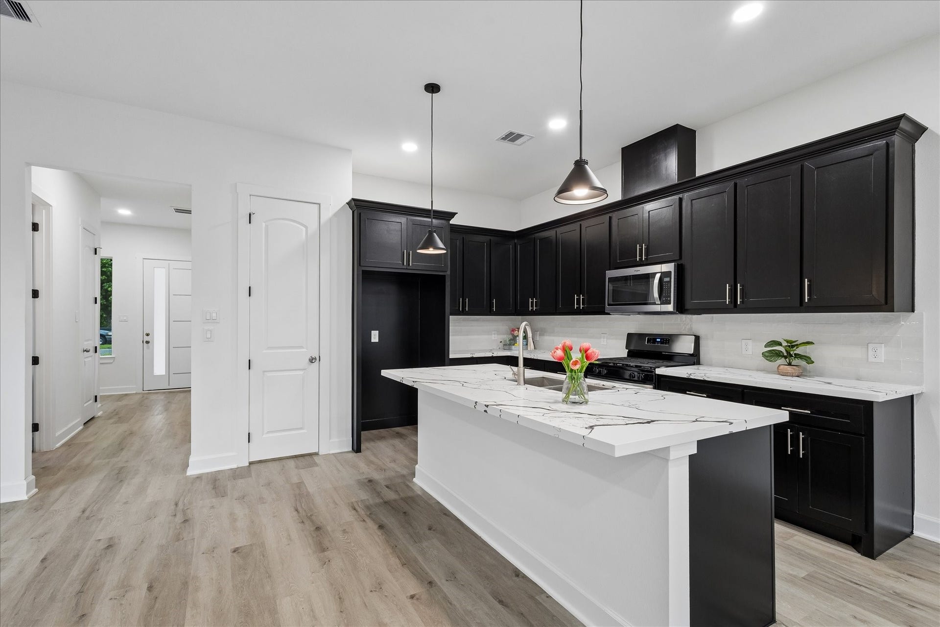 8715 Shotwell Street, #B, Houston, TX 77016 A beautifully designed modern kitchen. Stainless steel appliances are included but refrigerator not pictured.
