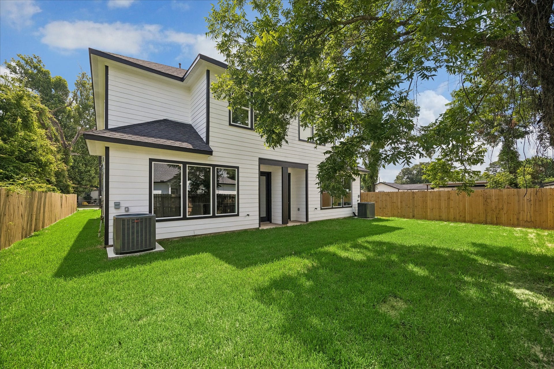 8715 Shotwell Street, #B, Houston, TX 77016 A spacious shared backyard offering plenty of room to enjoy the outdoors.