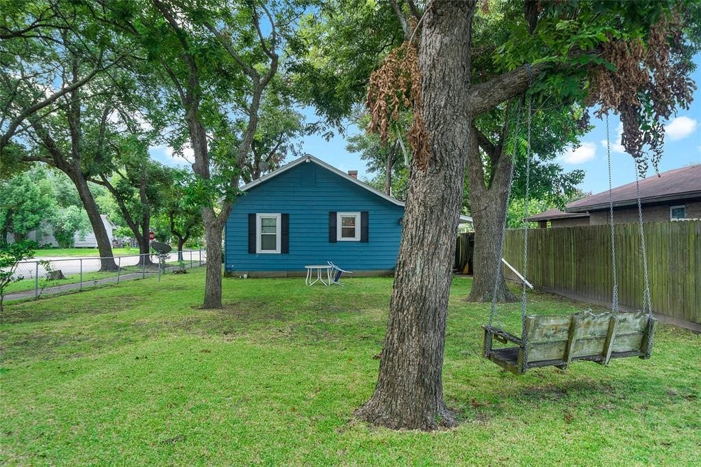 502 6th Avenue N, Texas City, TX 77590 Plenty of room for relaxing and entertaining in this yard, even room to park a boat and separate double gate entrance.