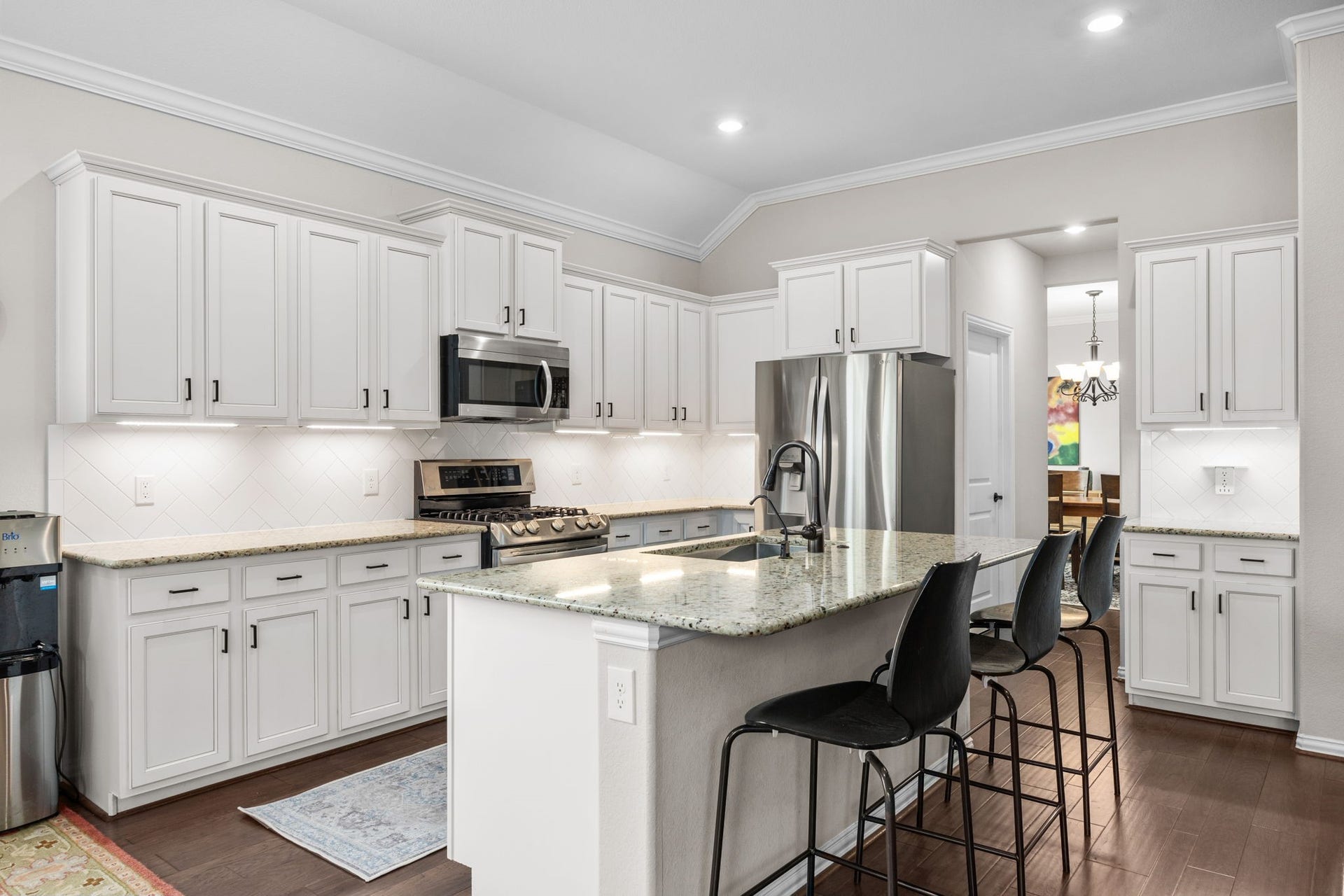Kitchen open to the living area with a pass through to the formal dining room.