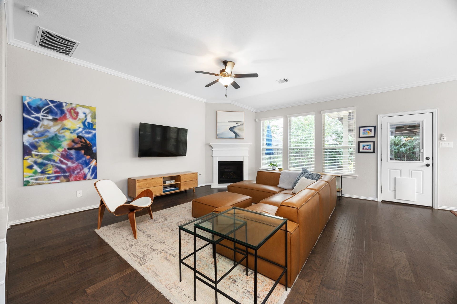 Bright and inviting living room featuring a cozy gas fireplace.