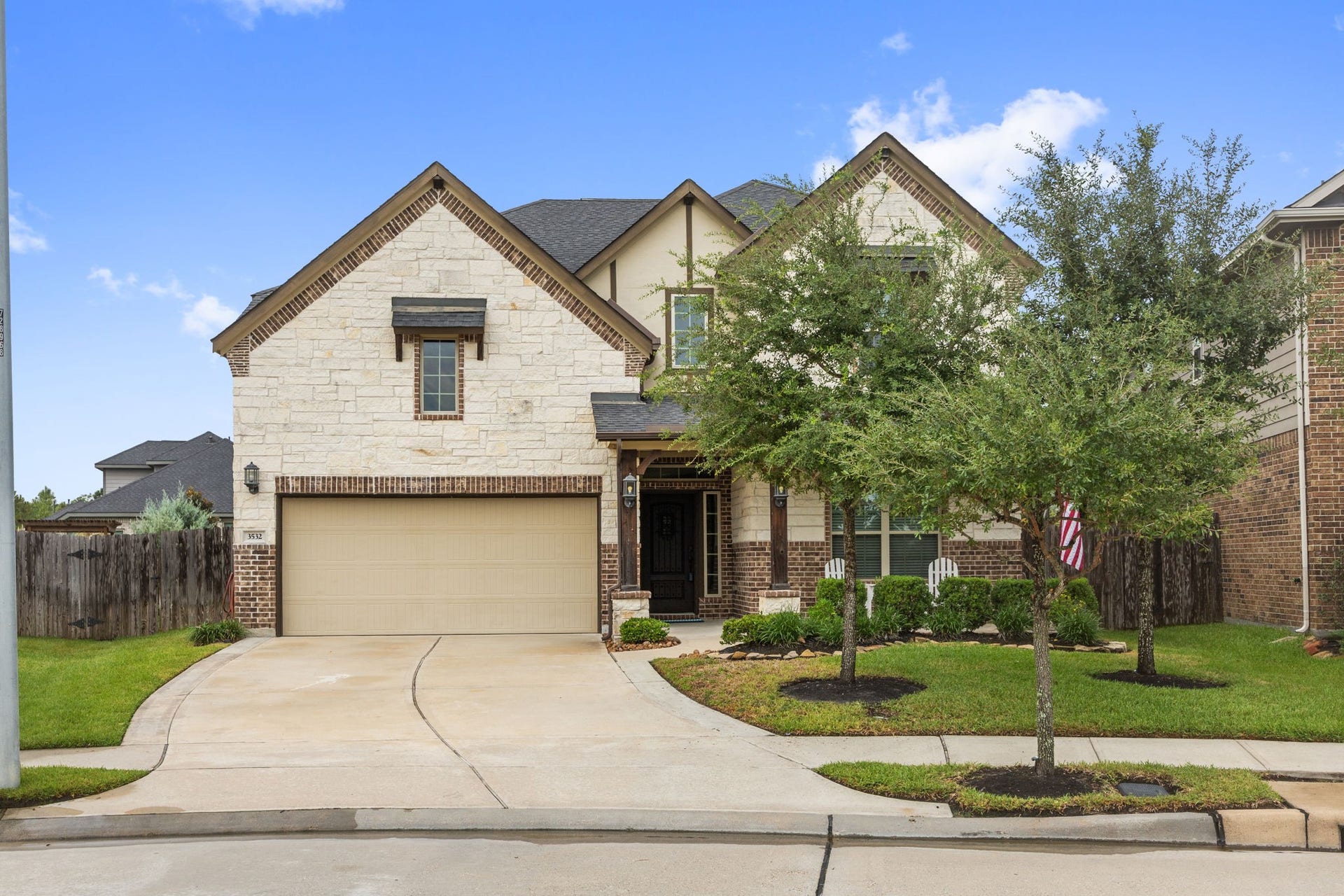 Well-maintained landscaping, nestled in a serene neighborhood.