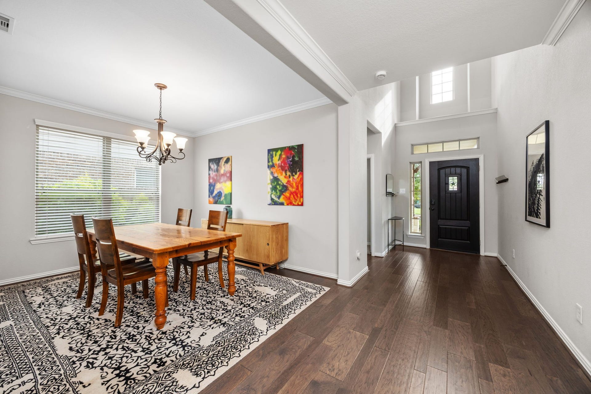 Elegant dining area with large windows bring in a ton of natural light.