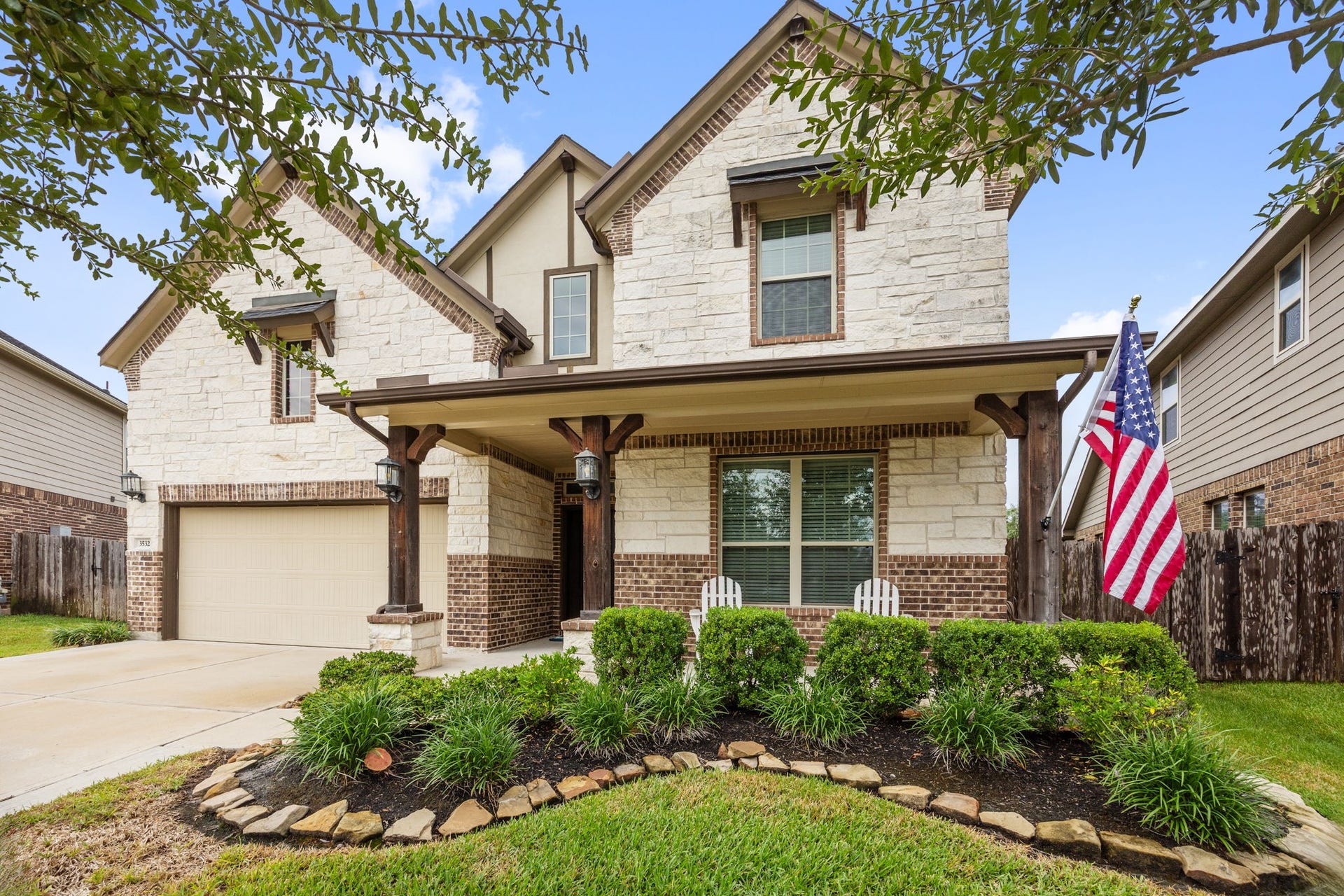 Charming two-story home with a welcoming front porch on a quiet cul-de-sac.
