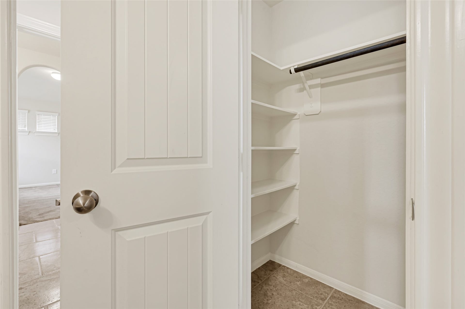 736 Somerset Landing Lane, League City, TX 77573 Spacious walk-in closet with built-in shelving and ample hanging space.