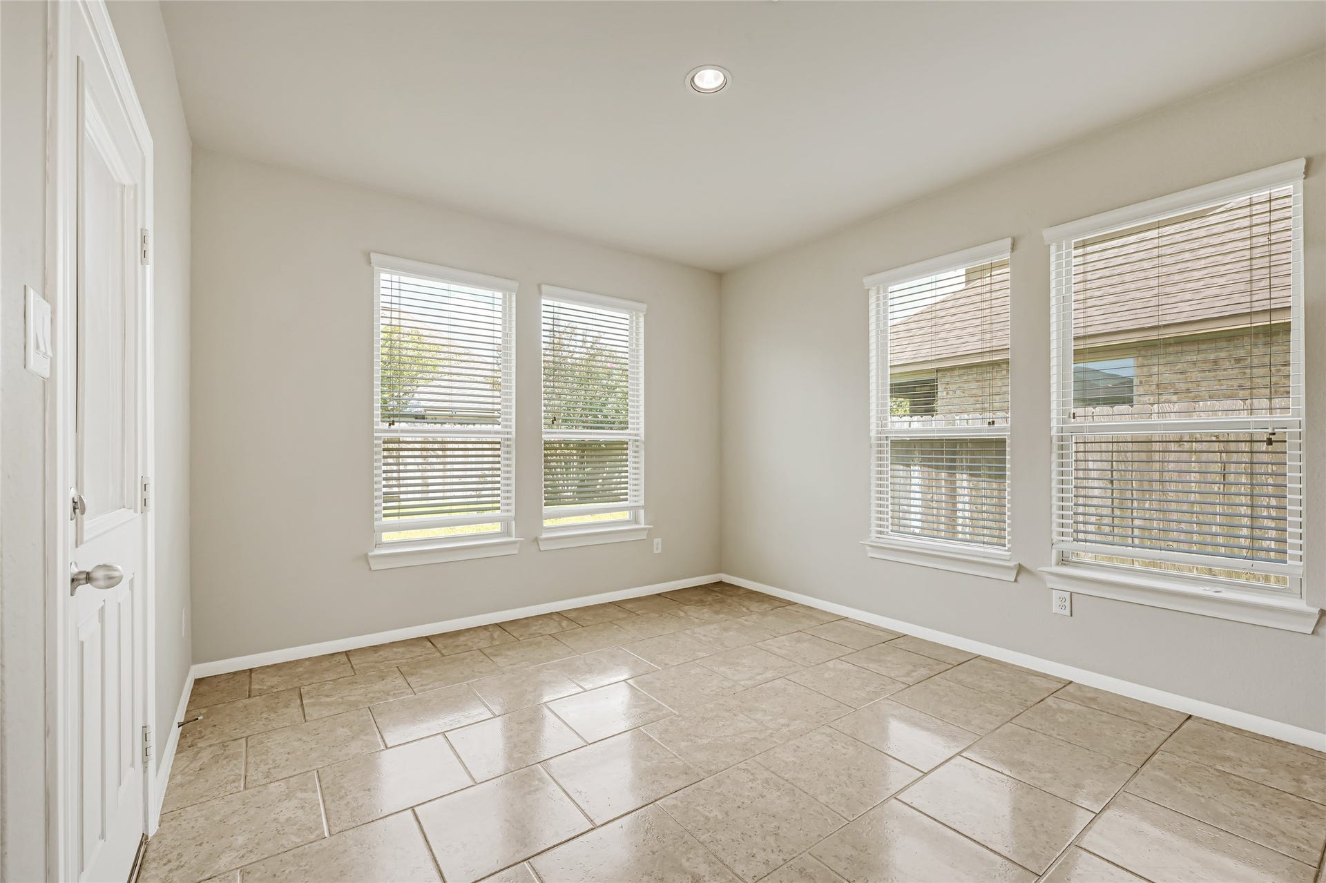 736 Somerset Landing Lane, League City, TX 77573 Bright enclosed flex room with tile flooring, multiple windows, and views of the backyard.