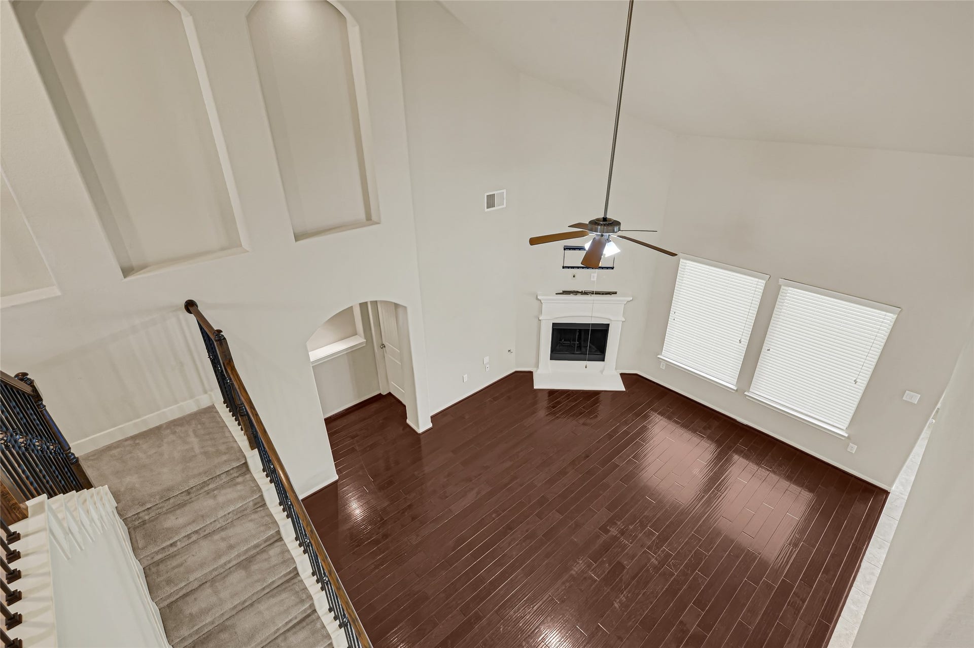 736 Somerset Landing Lane, League City, TX 77573 Elevated view of the hardwood foyer, entry doors, and open staircase.