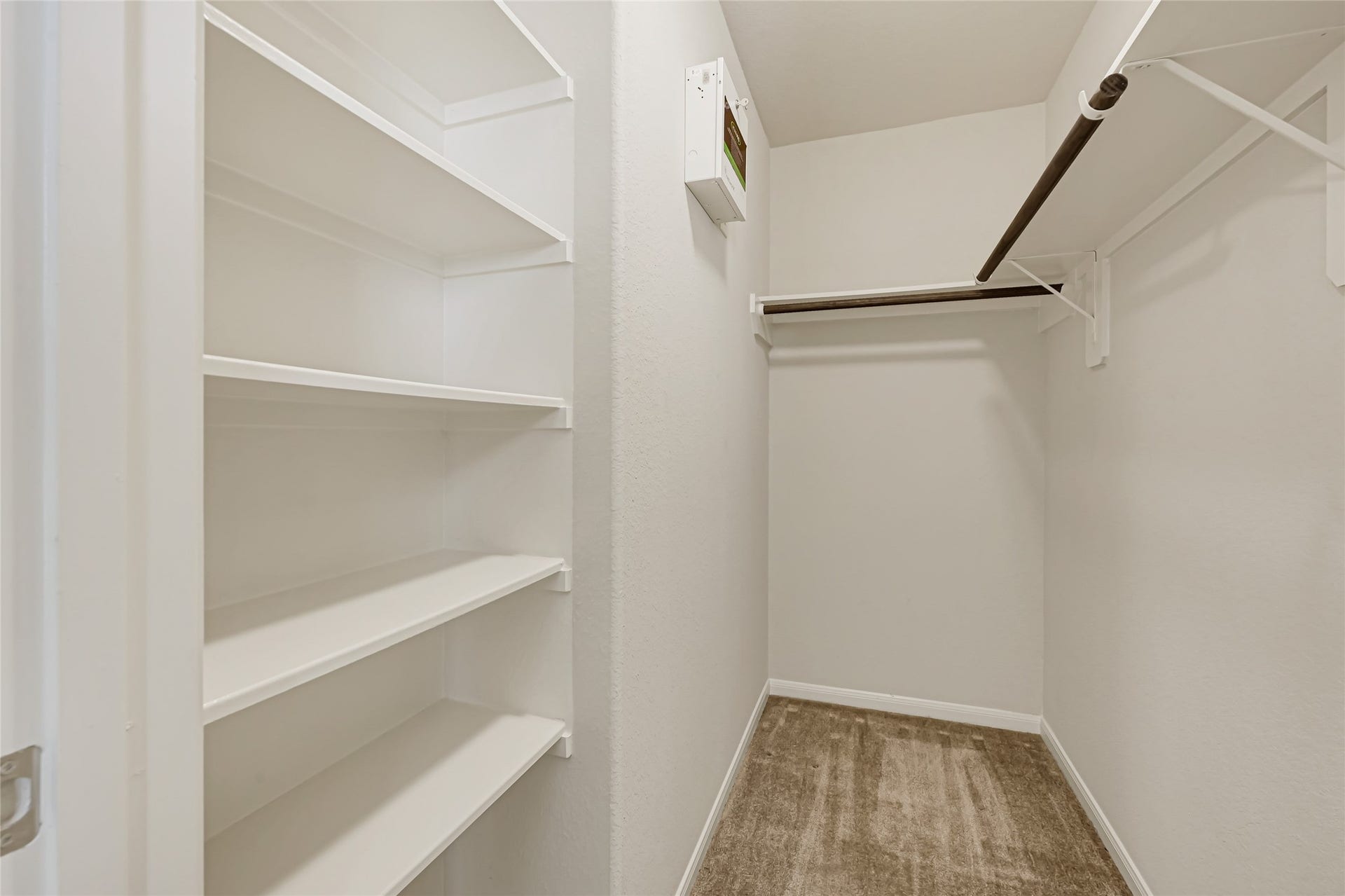 736 Somerset Landing Lane, League City, TX 77573 Functional walk-in closet with built-in shelving and ample storage space.