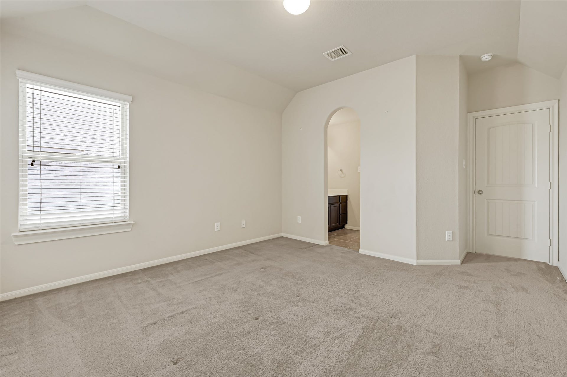 736 Somerset Landing Lane, League City, TX 77573 Bright bedroom with neutral carpet, natural light, and convenient access to the hallway.
