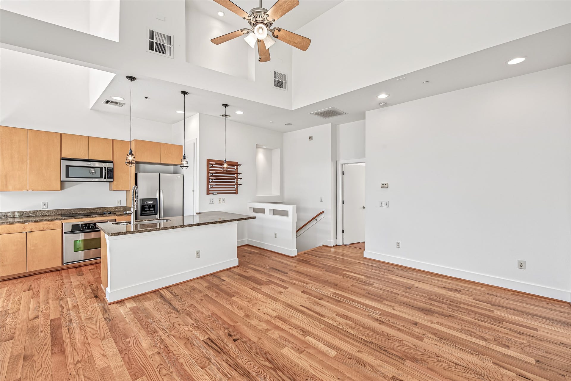 1555 Birdsall Street, #A, Houston, TX 77007 The grand living room serves as the backdrop for the lifestyle you've been dreaming of. This expansive space offers endless possibilities to relax, entertain, and make it uniquely yours.