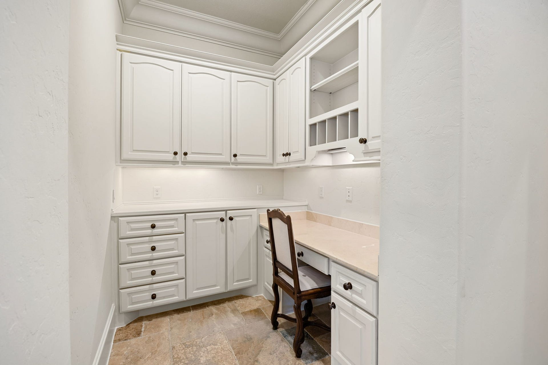 2127 Fawn Meadow Lane, Richmond, TX 77406 Convenient utility area featuring built-in cabinetry, counter space, and a desk.