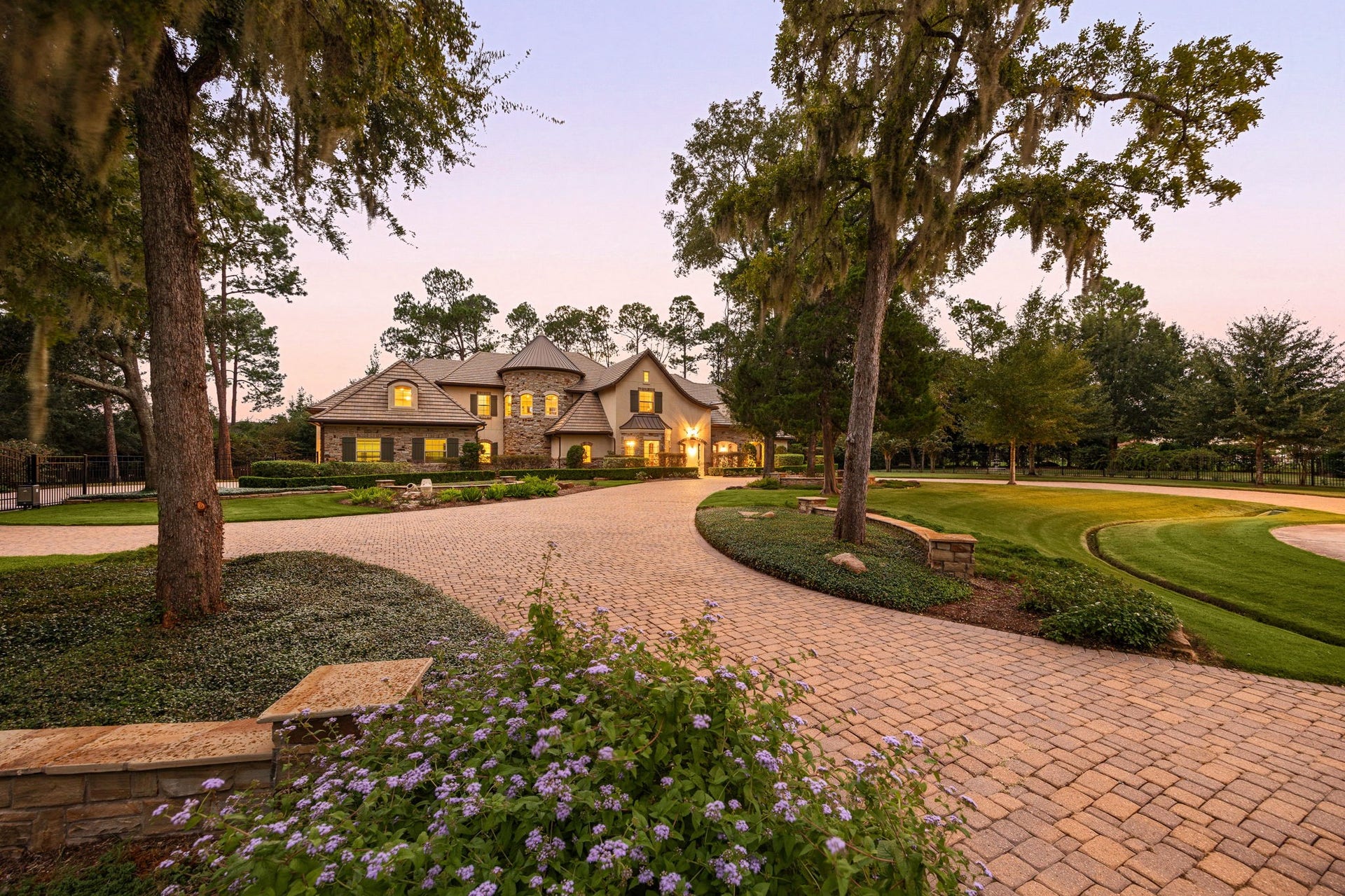 2127 Fawn Meadow Lane, Richmond, TX 77406 Beautiful circular pavestone driveway with gorgeous landscaping and trees providing an elegant approach to the home.