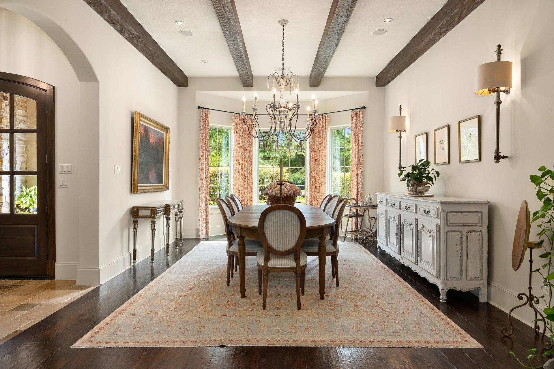 2127 Fawn Meadow Lane, Richmond, TX 77406 Elegant dining room featuring wood beams, custom lighting, and beautiful windows.