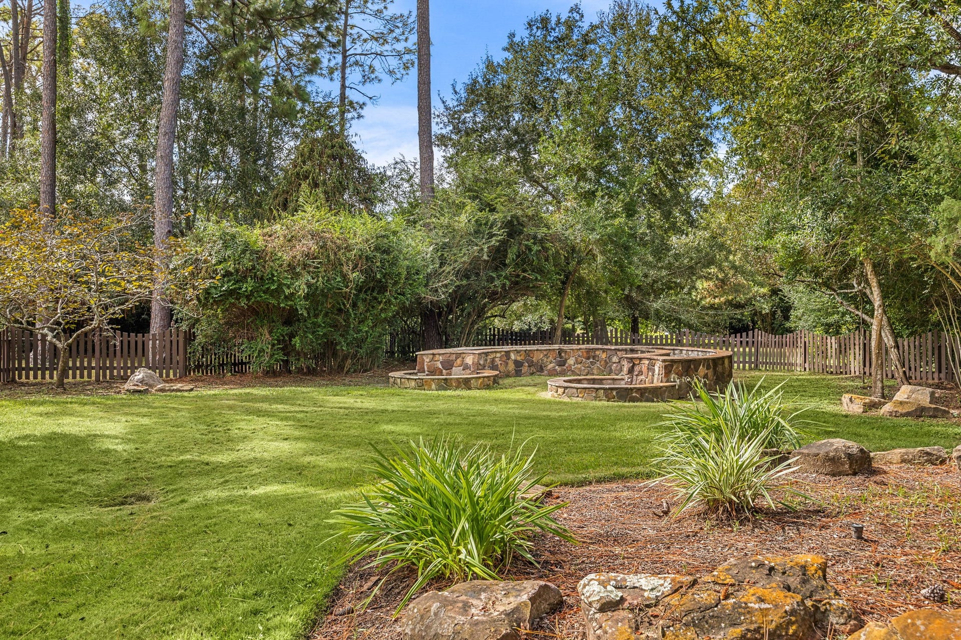 2127 Fawn Meadow Lane, Richmond, TX 77406 Additional view of the spacious grounds and mature trees with raised beds for growing fruits and vegetables.
