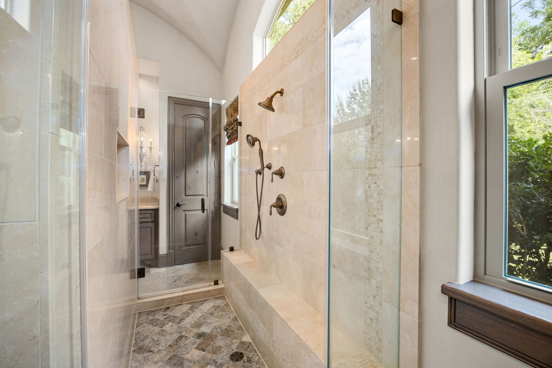 2127 Fawn Meadow Lane, Richmond, TX 77406 Bright bathroom showcasing a spacious glass enclosed shower, elegant finishes, and natural light.