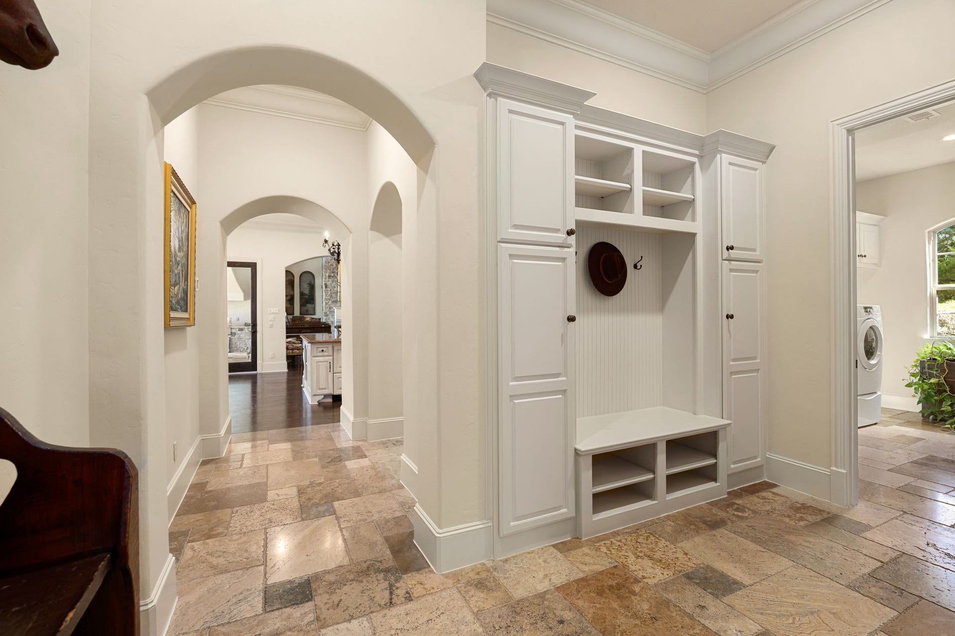 2127 Fawn Meadow Lane, Richmond, TX 77406 Spacious hallway with beautiful archways and built-in mud room storage just off the garage.