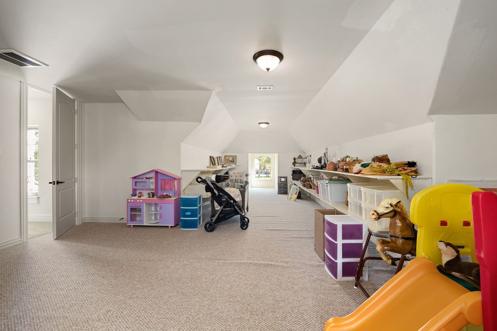 2127 Fawn Meadow Lane, Richmond, TX 77406 Versatile upstairs bonus room offering flexible space for storage or additional rooms.
