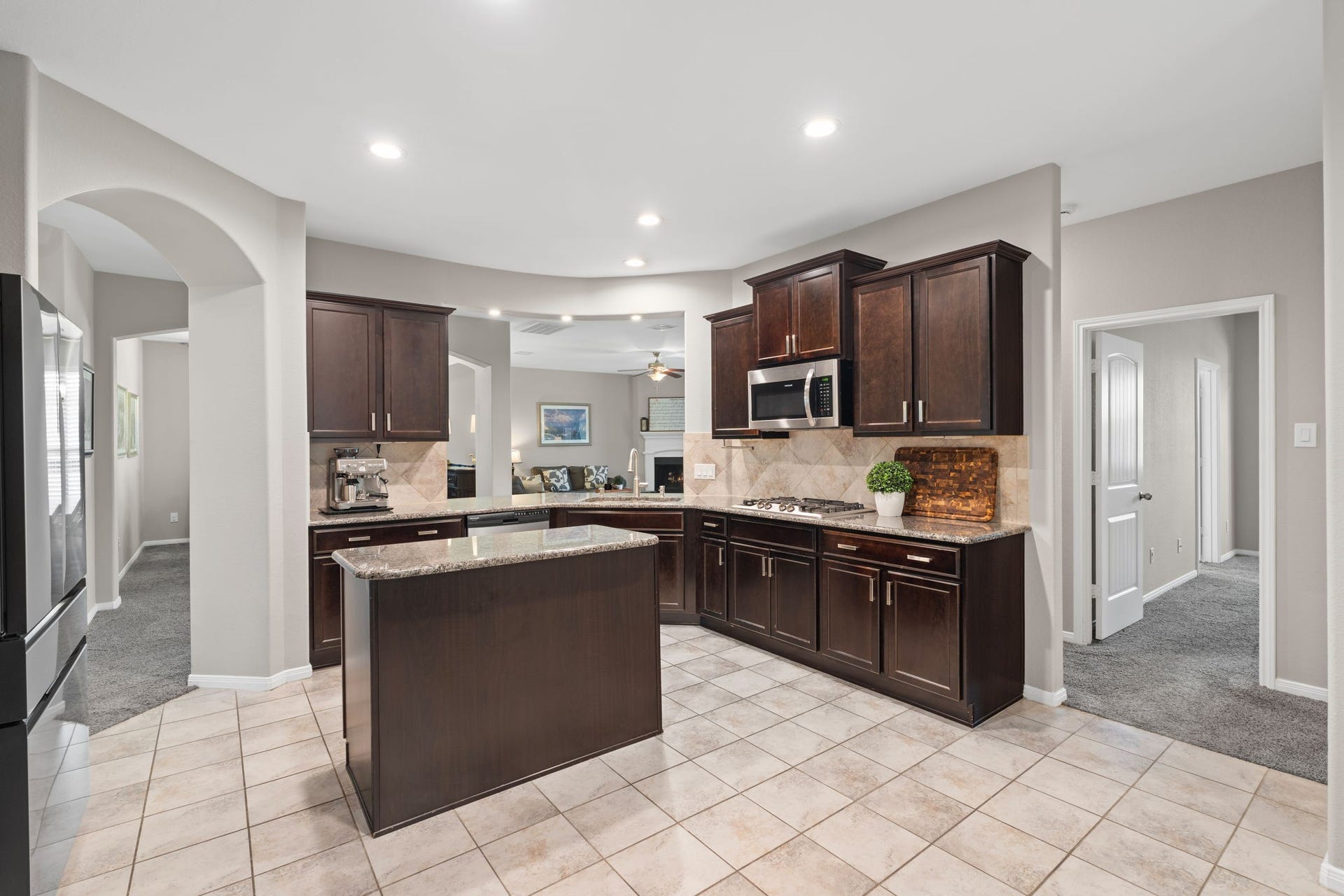 23418 Tirino Shores Drive, Katy, TX 77493 The open-concept kitchen stands as the centerpiece of the home