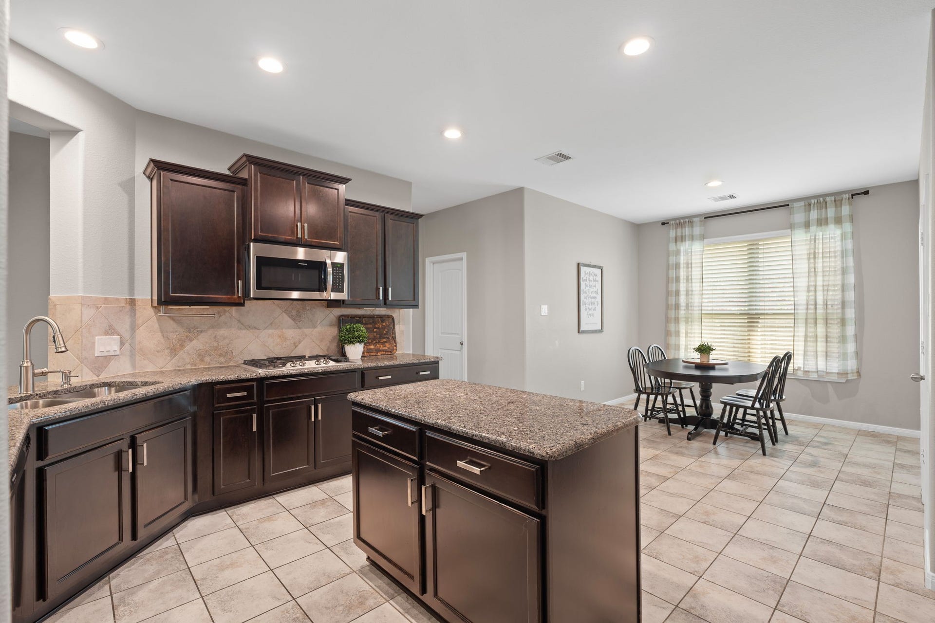 23418 Tirino Shores Drive, Katy, TX 77493 Offering an island, sleek finishes, and abundant storage perfect for both cooking and entertaining.
