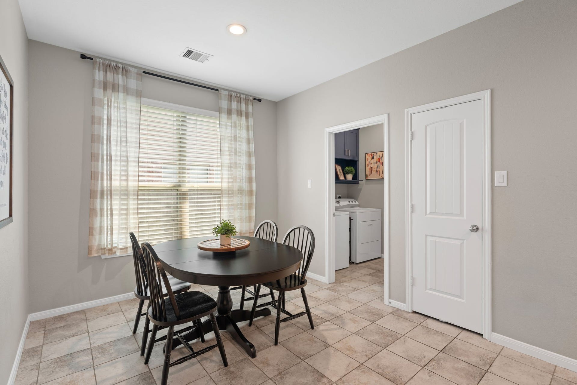 23418 Tirino Shores Drive, Katy, TX 77493 Convenient rear access door through a laundry room and the other door to walk-in pantry