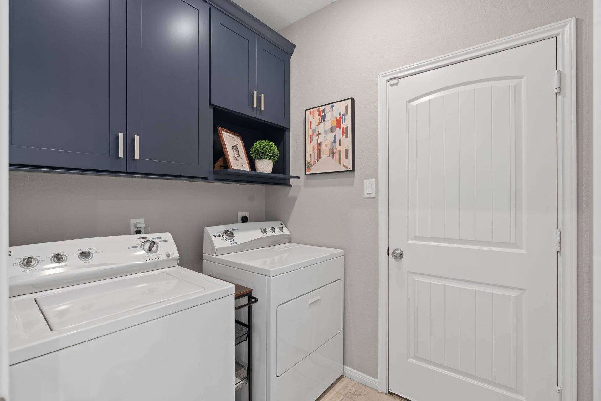 23418 Tirino Shores Drive, Katy, TX 77493 Custom cabinetry in laundry room