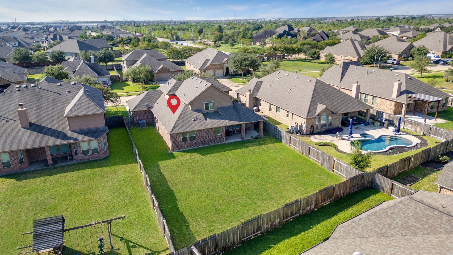 23418 Tirino Shores Drive, Katy, TX 77493 Beautiful four sided brick on first floor and gutters all around.