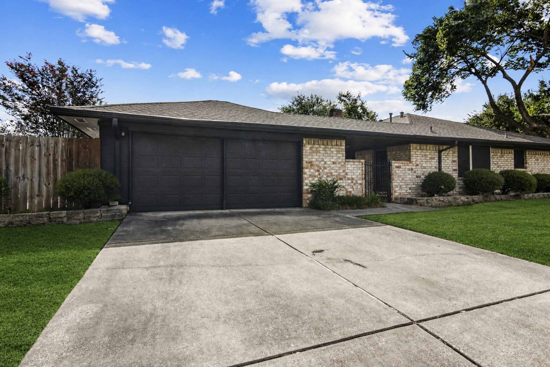 Detached garage with double wide driveway.