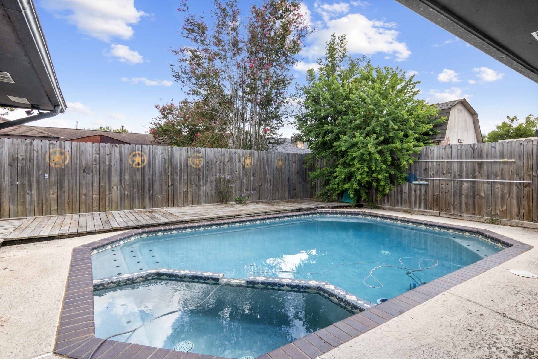 Decking on backside of pool.