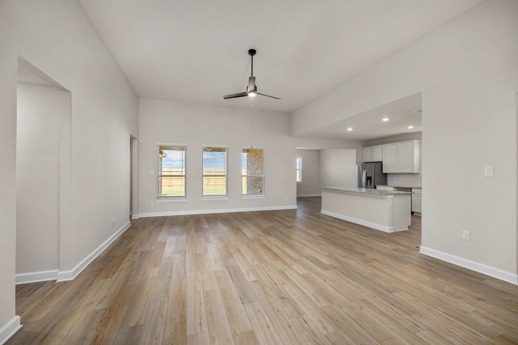 2921 Fair Wind Lane, Texas City, TX 77510 Experience seamless living in this bright and airy living room with an open floor plan that flows effortlessly into the kitchen while offering picturesque views of the backyard. The perfect blend of comfort and style for entertaining and relaxation.
