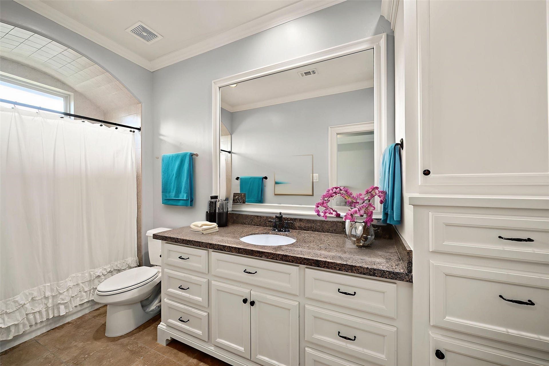 10506 Pebblecreek Crossing, Katy, TX 77494 Kitchen with white cabinetry and generous counter space.