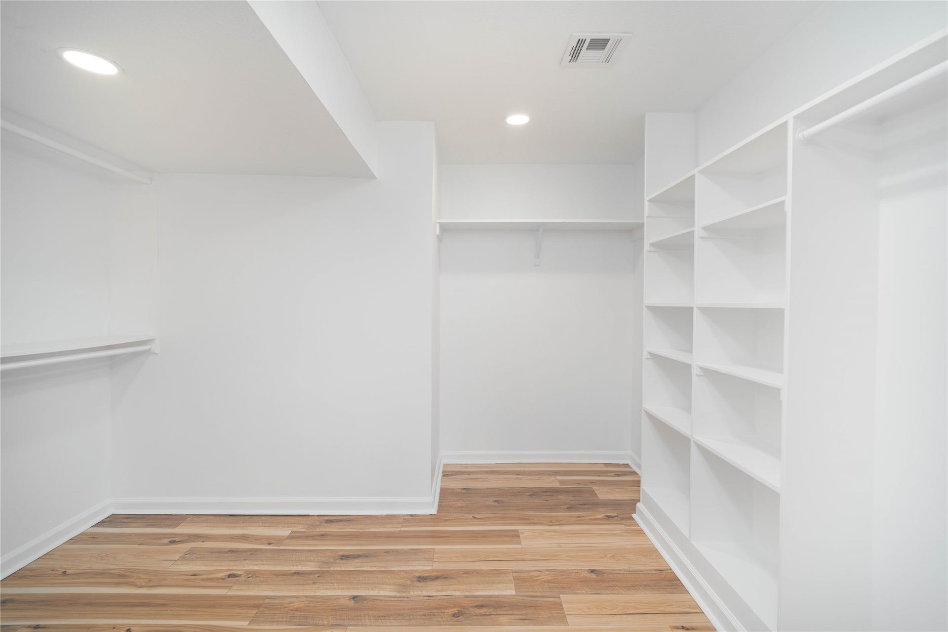 1635 Pony Lane, Wallis, TX 77485 Primary Walk-In Closet Large walk-in closet with built-in shelving and ample storage for wardrobe organization.
